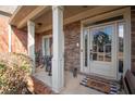 Inviting front porch of stone home with decorative wreath and 'XOXO Fall' doormat at 1030 Silver Thorne Dr, Loganville, GA 30052