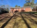 Large backyard with mature trees, providing ample shade and privacy, great for entertaining at 10836 Mallard Dr, Jonesboro, GA 30238