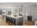 Modern kitchen featuring a large island, gray cabinets, and stainless steel appliances at 127 Harlow Cir, Roswell, GA 30076