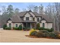 Charming two-story brick home showcasing well-maintained landscaping and a welcoming entrance at 3591 Lochwolde Ln, Snellville, GA 30039