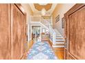 Grand foyer featuring a soaring ceiling, elegant chandelier, and hardwood floors at , Atlanta, GA 30327