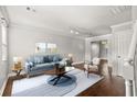 Bright living room boasts hardwood floors and neutral paint, offering a welcoming and spacious atmosphere at 265 Winding River Dr # F, Atlanta, GA 30350