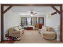 Living room with light colored walls, a ceiling fan, and two couches at 4648 Seward Rd, Powder Springs, GA 30127