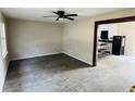 Inviting living room featuring neutral paint, wood-look floors, and ceiling fan at 120 Mossy Brook Dr, Stockbridge, GA 30281