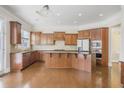 Spacious kitchen features wooden cabinets, granite countertops, and stainless steel appliances at 4669 Prater Se Way, Smyrna, GA 30080