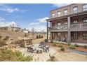 An elevated view of the backyard and patio, featuring an outdoor fireplace and dining area at 6785 Pippin Walk, Alpharetta, GA 30005