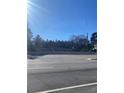 Street view of a building with a dark roof and trees in the background at 1902 Godby Rd, Atlanta, GA 30349