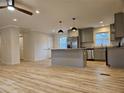 Open kitchen and living space with stainless appliances, granite countertops, and hardwood floors at , Decatur, GA 30032