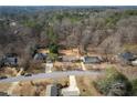 Overhead view of the home and lot highlighting its location in a wooded residential neighborhood at 541 Exam Ct, Lawrenceville, GA 30044