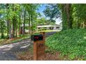 Secluded home on a wooded lot; note the long driveway and lush foliage creating privacy at 4770 Wayland Cir, Acworth, GA 30101