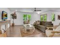 Bright living room with hardwood floors, neutral paint, and large windows showcasing the outdoor view at 4770 Wayland Cir, Acworth, GA 30101