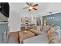 Stylish living space with an open floor plan with a seamless flow to the kitchen at 5528 Donerail St, Lithonia, GA 30058