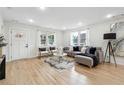 Well-lit living room showcasing hardwood floors, stylish furniture, and modern decor at 176 Rhodesia Se Ave, Atlanta, GA 30315