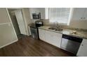 Modern kitchen with granite countertops, stainless steel appliances, and ample cabinet space at 4027 Gladesworth Ln, Decatur, GA 30035