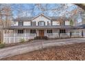 Charming two-story home featuring a welcoming front porch with a double door entrance at 1700 Bailey Creek Sw Rd, Conyers, GA 30094