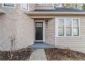 Inviting front entrance featuring a black door with a stone and siding facade at 994 Chapman Cir, Stone Mountain, GA 30088