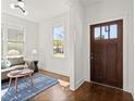 Inviting entryway with a hardwood front door, and a cozy seating area with hardwood floors at 1183 Mobile Nw St, Atlanta, GA 30314