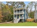 Charming two-story home with a welcoming front porch and professionally landscaped front yard at 1183 Mobile Nw St, Atlanta, GA 30314