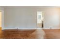 Bright living room featuring wood floors, neutral walls and a connecting room at 1850 Brewer Sw Blvd, Atlanta, GA 30310