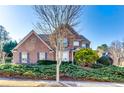 Inviting brick home with manicured greenery and a well-maintained lawn at 3135 Preservation Cir, Lilburn, GA 30047