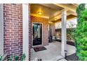 Inviting front porch featuring brick accents and a charming entrance at 3135 Preservation Cir, Lilburn, GA 30047