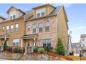 Beautiful brick townhome with a classic design and well-kept front yard at 3320 Reagan Way # 80, Lawrenceville, GA 30044