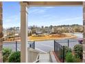 Scenic community view from the porch, showcasing nearby homes, a playground and landscaping at 3320 Reagan Way # 80, Lawrenceville, GA 30044