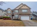 Attractive two-story home featuring brick facade, shuttered windows and a two-car garage at 982 Ashton Park Dr, Lawrenceville, GA 30045