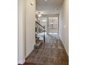 The foyer has carpet flooring with stairs to the upper level at 2293 Chancery Mill Ln, Buford, GA 30519