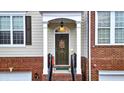 Inviting front entrance with decorative door and classic architectural details at 236 Balaban Cir, Woodstock, GA 30188