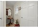 Inviting foyer with tile flooring, a decorative mirror, and fresh décor at 1745 Pierce Arrow Pkwy, Tucker, GA 30084