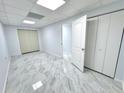 Basement area with elegant gray flooring, offering versatility for storage, play area, or a home office at 6553 Meadowbrook Ln, Morrow, GA 30260