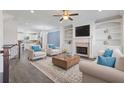 Inviting living room boasts a fireplace, built-in shelves, and an open floor plan at 2710 Birch Grove Se Ln # 13, Marietta, GA 30067