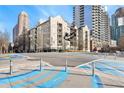 Beautiful building exterior featuring balconies, a well-maintained landscape, and attractive architecture at 1075 Peachtree Walk # A-307, Atlanta, GA 30309