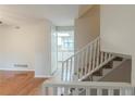 Hallway and staircase with views into the kitchen at 3090 Chimney W Rdg, Snellville, GA 30078