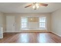 Bright living room with hardwood floors, a ceiling fan, and natural light at 3090 Chimney W Rdg, Snellville, GA 30078