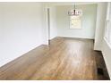 Bright living room featuring hardwood floors, white walls, and natural light from windows at 4206 Sherwood Ave, Decatur, GA 30035