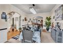 Elegant dining room with chandelier, wainscoting, and access to other rooms at 8034 Bradshaw Ct, Douglasville, GA 30134