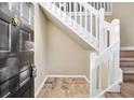 Welcoming entryway featuring unique tile flooring and a staircase at 1482 N Crossing Ne Cir, Atlanta, GA 30329