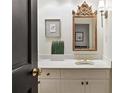 Elegant powder room features an ornate mirror, custom vanity, and stylish decor at 3131 Nw Slaton Nw Dr # 24, Atlanta, GA 30305