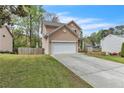 Charming two-story home with a two-car garage, well-manicured lawn, and inviting front porch at 4567 Hickory Forest Nw Dr, Acworth, GA 30102