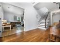 Bright foyer with hardwood floors flows into the living room and staircase to the second level at 2832 Old Villa Rica Rd, Powder Springs, GA 30127