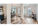 Dining room with modern chandelier, stylish decor, and wood-look flooring at 625 Aunt Lucy Sw Ln # 34/19, Smyrna, GA 30082