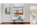 Cozy sitting area with bench by a large arched window, offering ample natural light at 140 Stonegate Ln, Canton, GA 30114