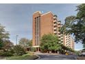 Exterior view of the beautiful brick apartment building featuring multiple stories and private balconies at 300 Johnson Ferry Ne Rd # B411, Atlanta, GA 30328