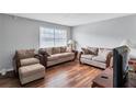 Well-lit living room with matching sofas and wooden accents at 4701 Flat Shoals Rd # 37C, Union City, GA 30291