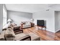 Cozy living room featuring wood floors, sofas, and natural light at 4701 Flat Shoals Rd # 37C, Union City, GA 30291