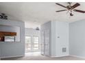 Bright living room with a ceiling fan and a pass through to the kitchen at 3610 Ginnis Rd # 4, Atlanta, GA 30331