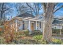 A charming single-story home with traditional architecture and mature trees surrounding the property at 959 Glen Arden Ne Way, Atlanta, GA 30306