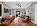 Eclectic living room with patterned rug, sofa, and curated art providing a cozy and stylish space at 93 Peachtree Ne Pl # 5, Atlanta, GA 30309